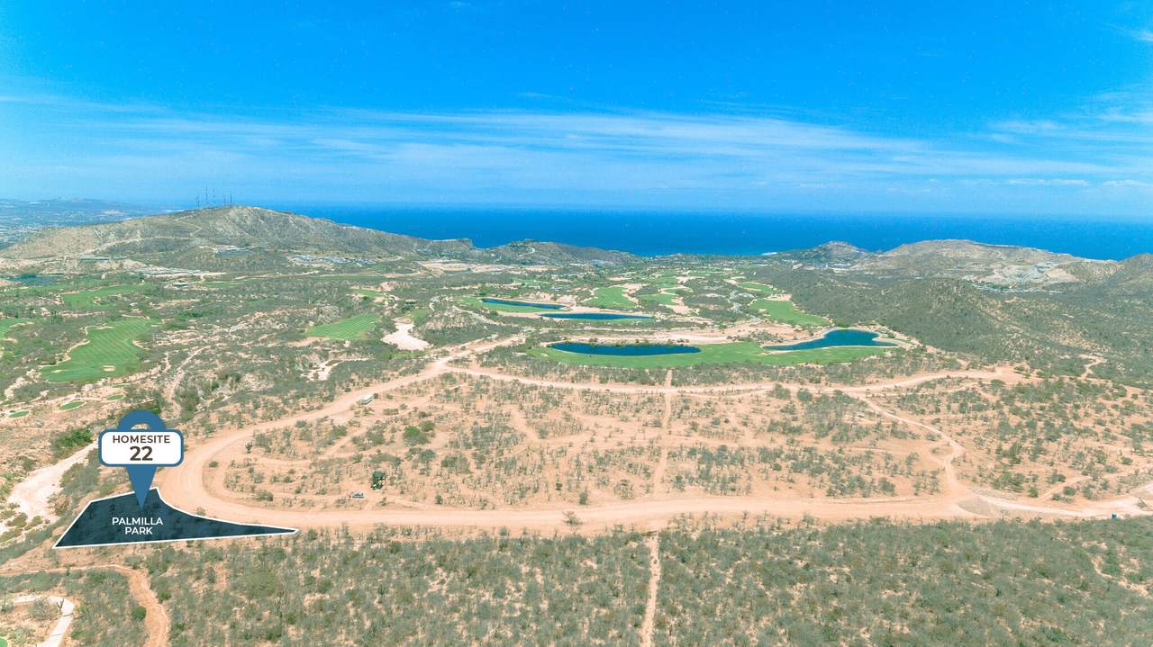 A Golf Course With Water In The Background