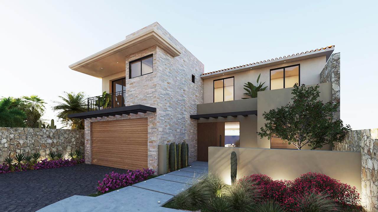 A House With A Driveway And Plants