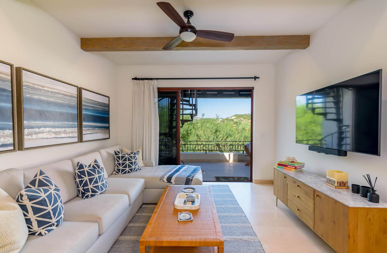 A Living Room With A Couch And A Television
