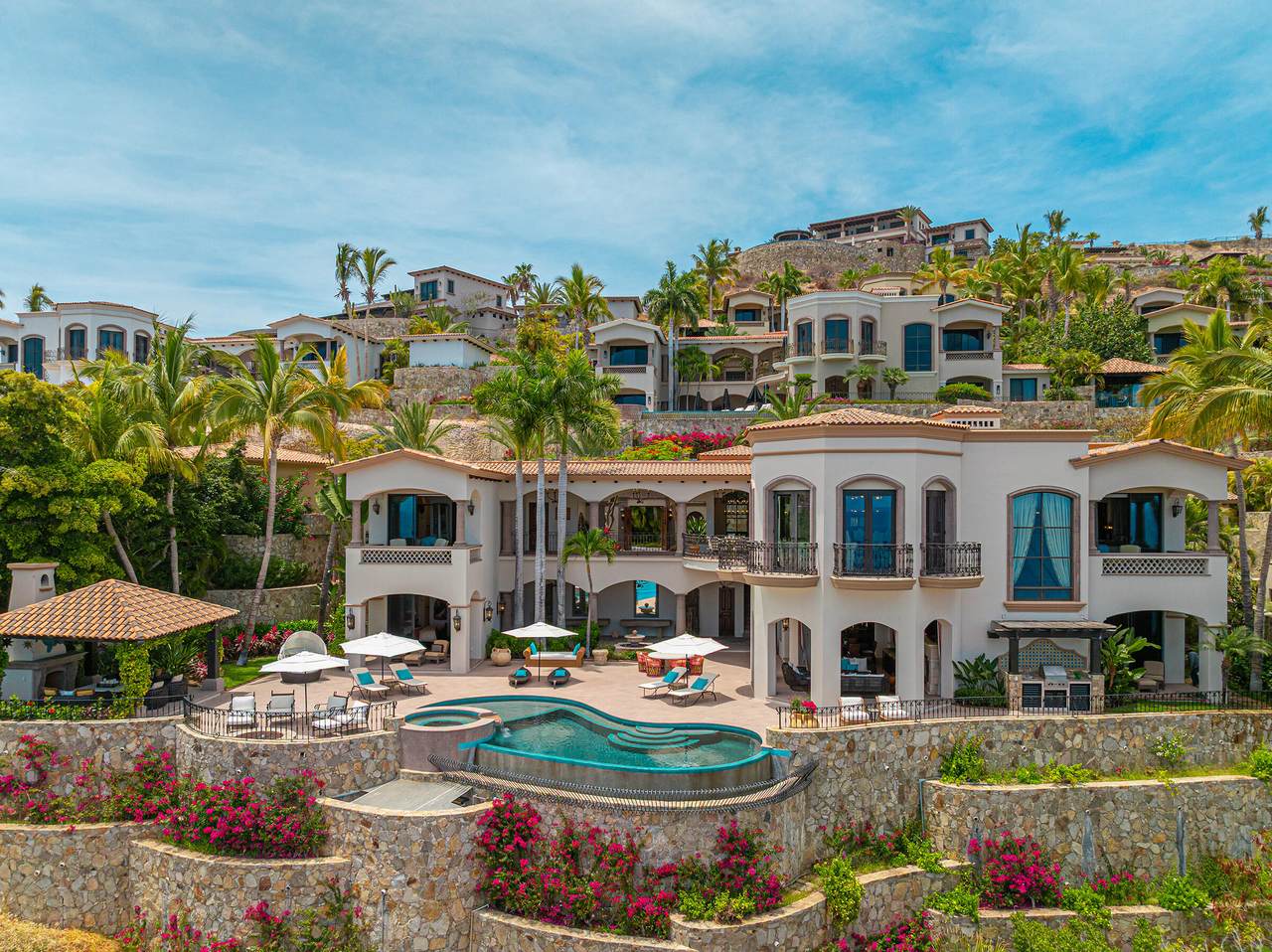 A House With A Pool And Palm Trees