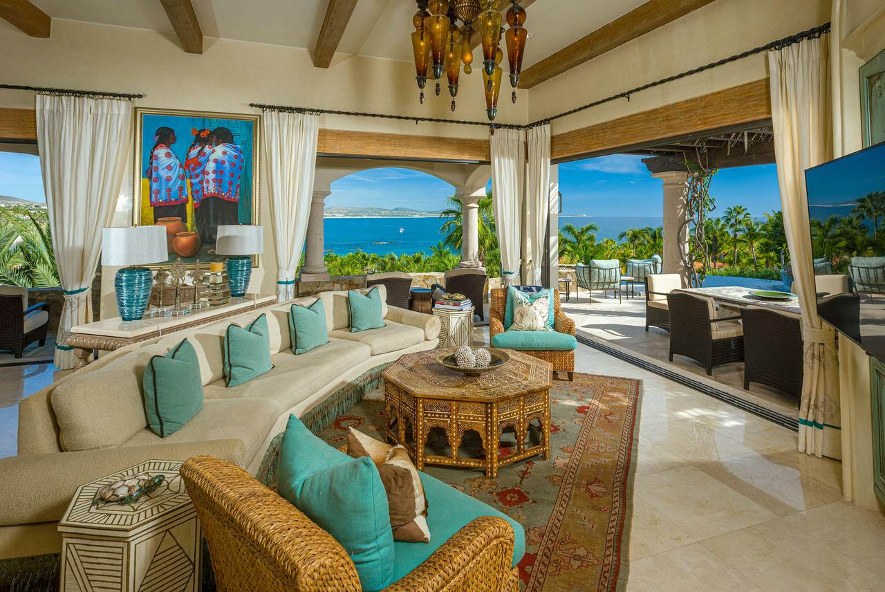 A Living Room With A Large Couch And A Table