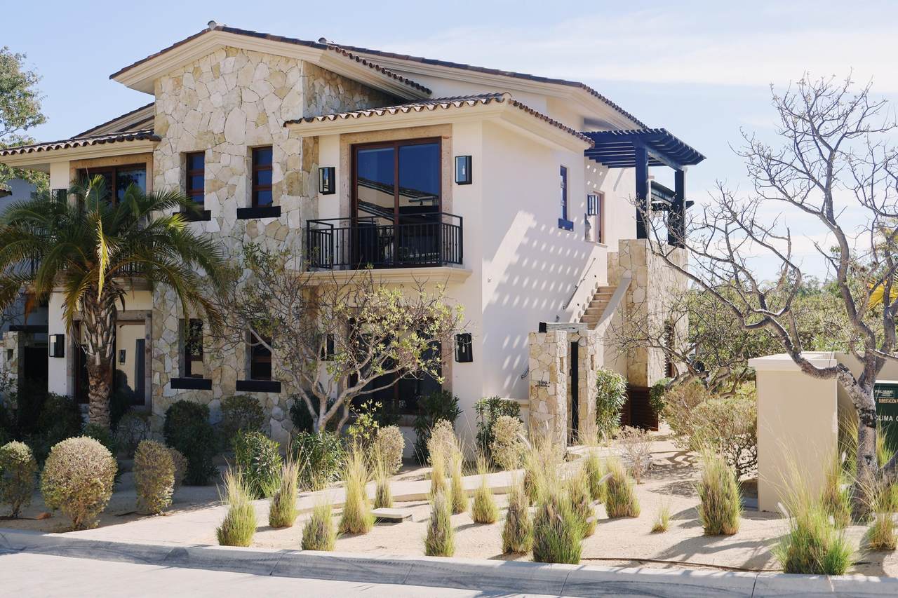 A House With A Stone Wall And A Stone Wall And A Stone Wall